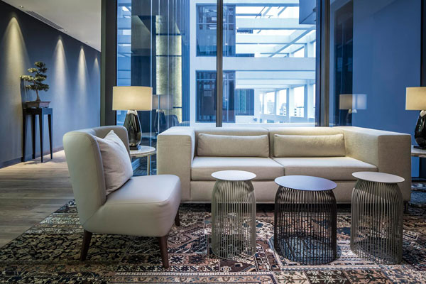 Swirls-of-colour-from-custom-made-carpets,-paired-with-backlit-wall-panels-and-meticulously-selected-furniture,-give-the-public-spaces-a-fresh-look