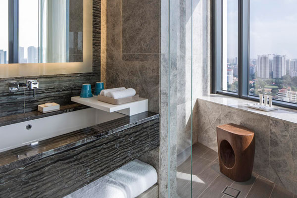 The-suite-at-the-Urban-Hotel-features-an-ample-workspace,-coupled-with-a-cosy-relaxation-area-to-unwind-after-a-long-day