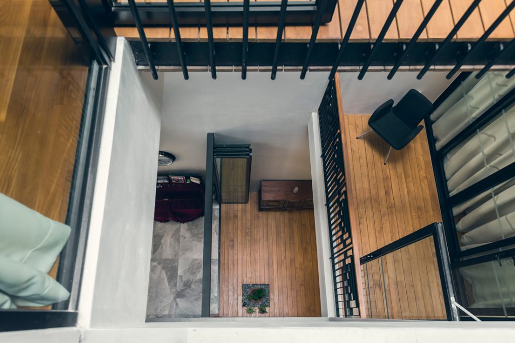 Yuk Tong Avenue House by MAKK Architects looking down into airwell