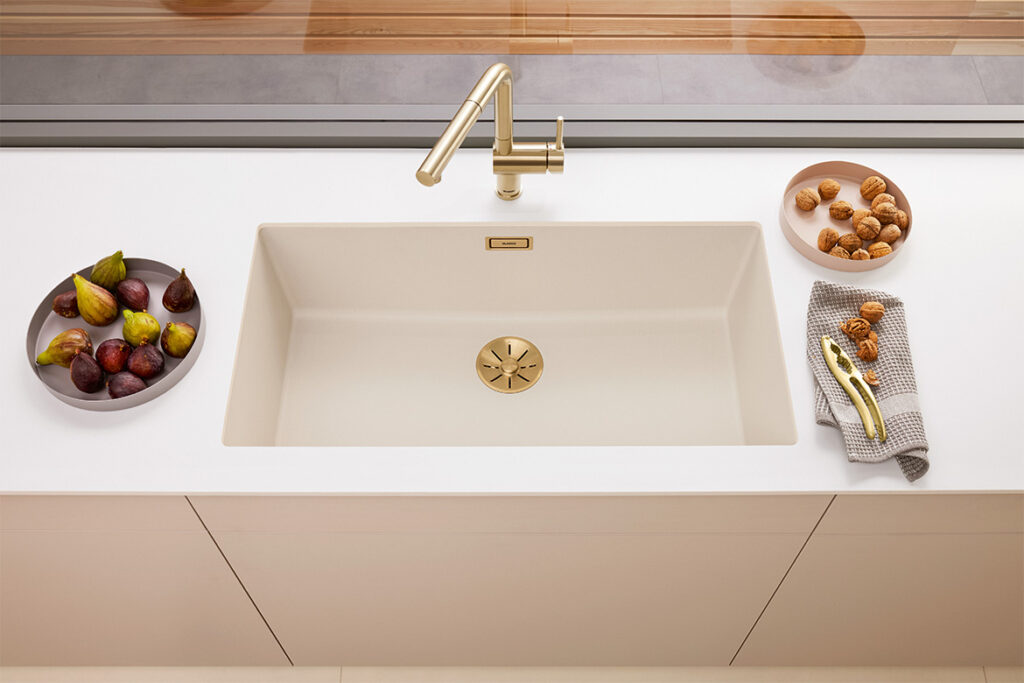 SUBLINE 800-U undermount sink in SILGRANIT® soft white and mixer tap in satin gold finish