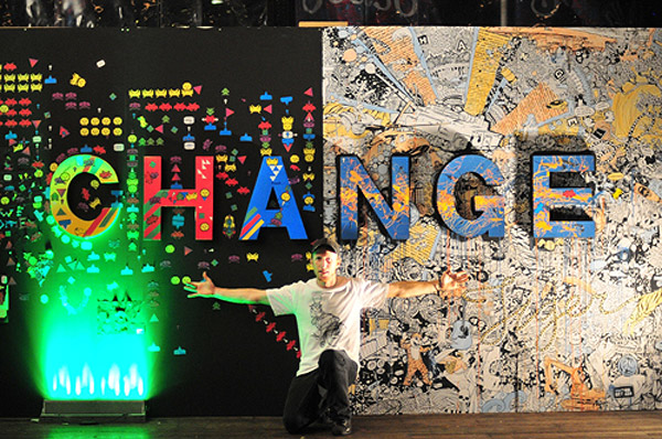 Tiger-Translate-winner-Ian-Mutch-with-artwork-created-by-himself-and-party-goers