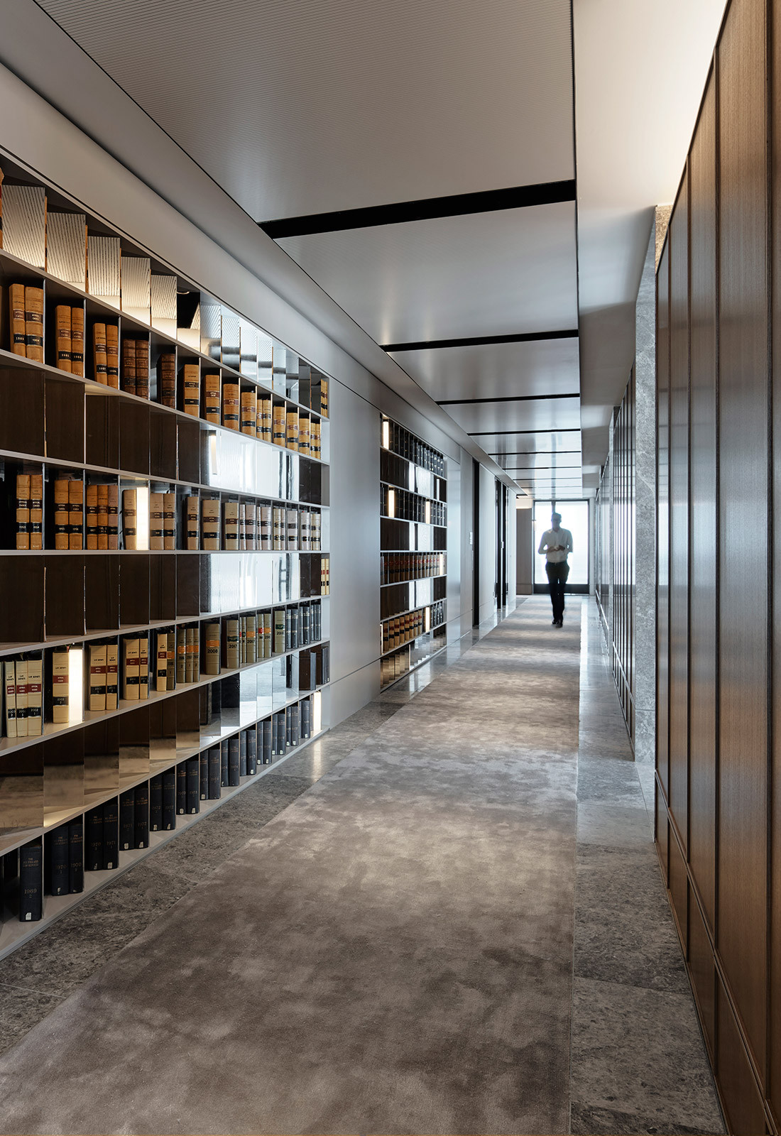 Bookcase lined corridor in Banco Chambers Martin Place office fitout, designed by Bates Smart