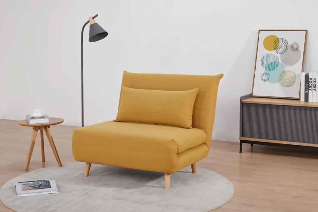 armless yellow armchair in living room with lamp style interior design