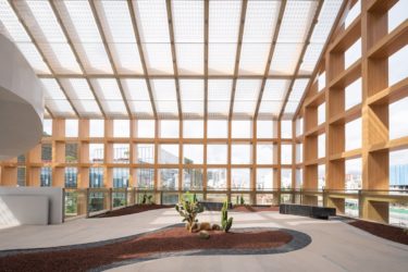 A semi-exposed interior section surrounded by gridded walls of Sanya Farm Lab.