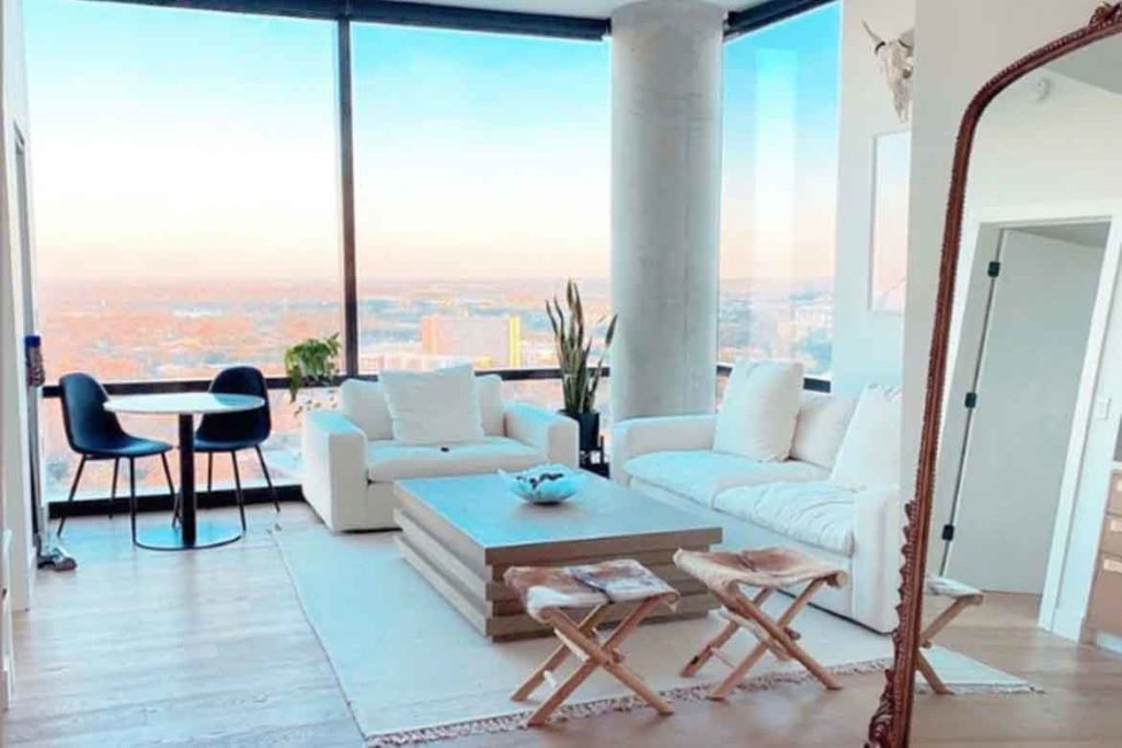 matching couch white in living room with sunset ocean views crisp and clean