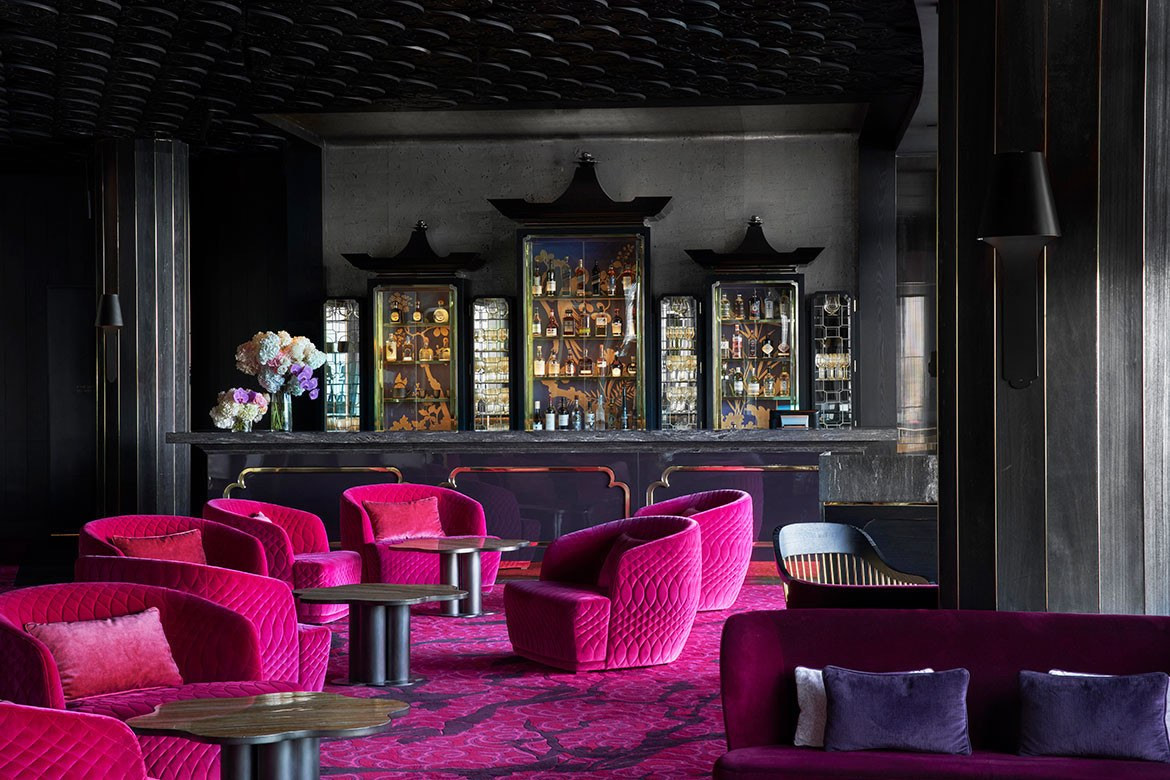 Cerise furnishings and a black bar in Bates Smart Teahouse Crown Sydney hospitality