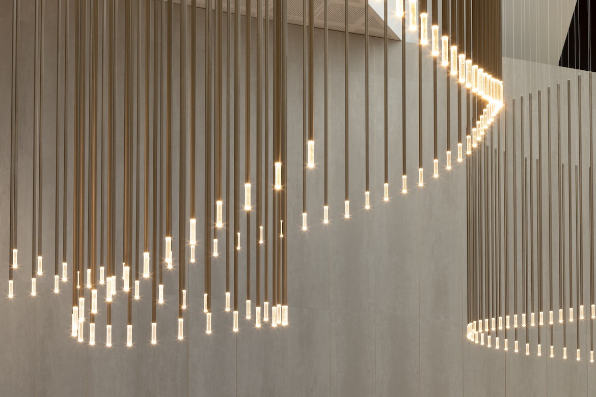 A close up of the sculptural hanging lighting in the lobby of 600 Bourke Place.