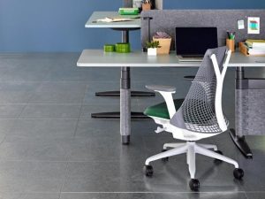 Ergonomic grey chair and desk essentials