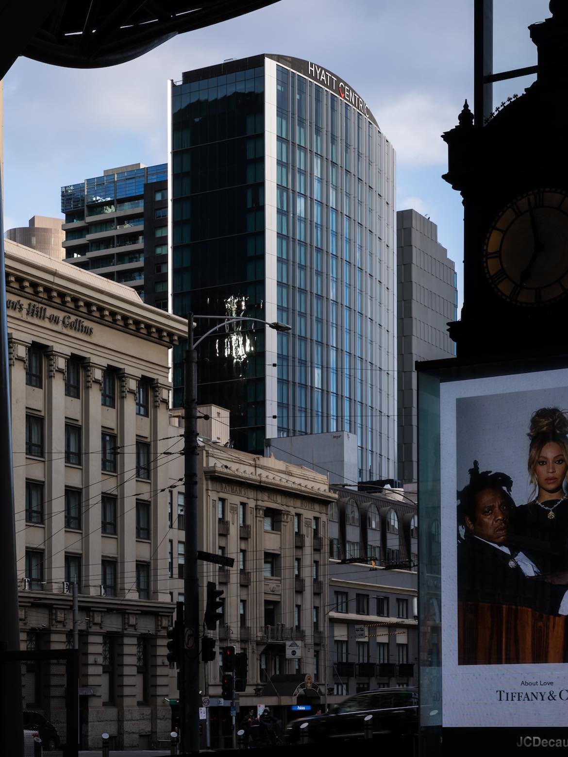 The tall exterior glass facade of the hotel, with the words Hyatt Centric at the pinnacle.