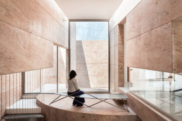 Behold this stone-clad elliptical office