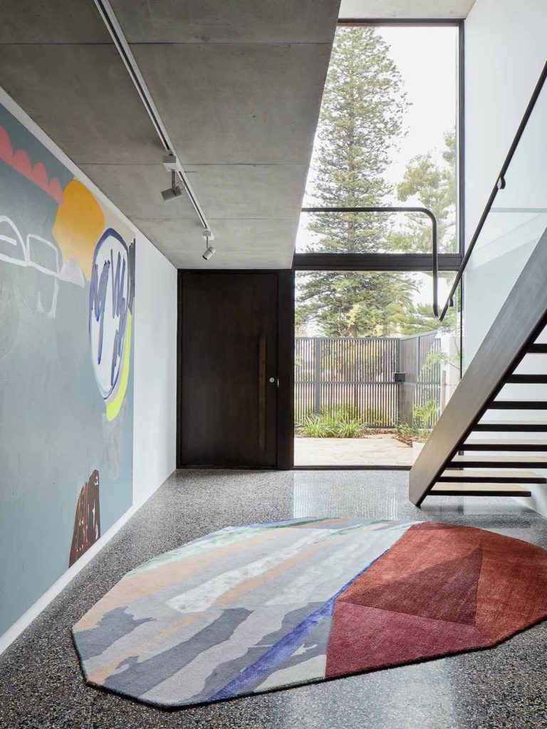 Shutter House by State of Kin featuring artwork entitled Look, by Elle Campbell, and Fordite rug by Patricia Urquiola for cc-tapis.