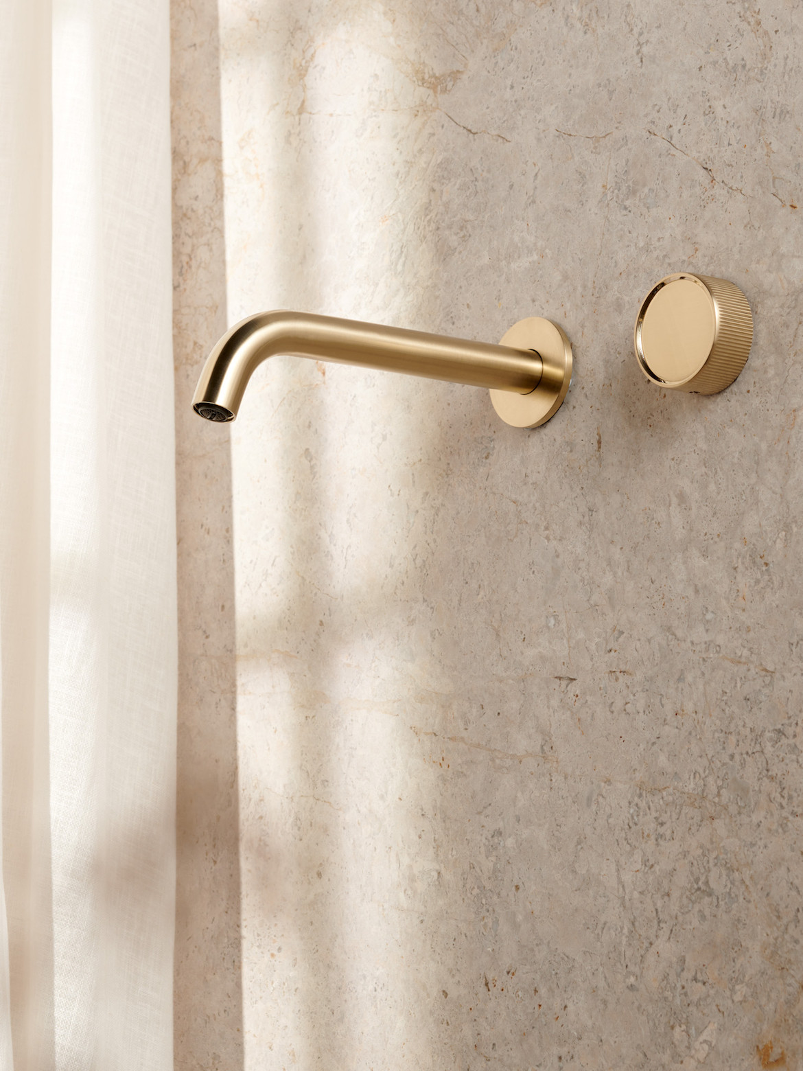 Novas Frame tap with progressive mixer in satin gold.