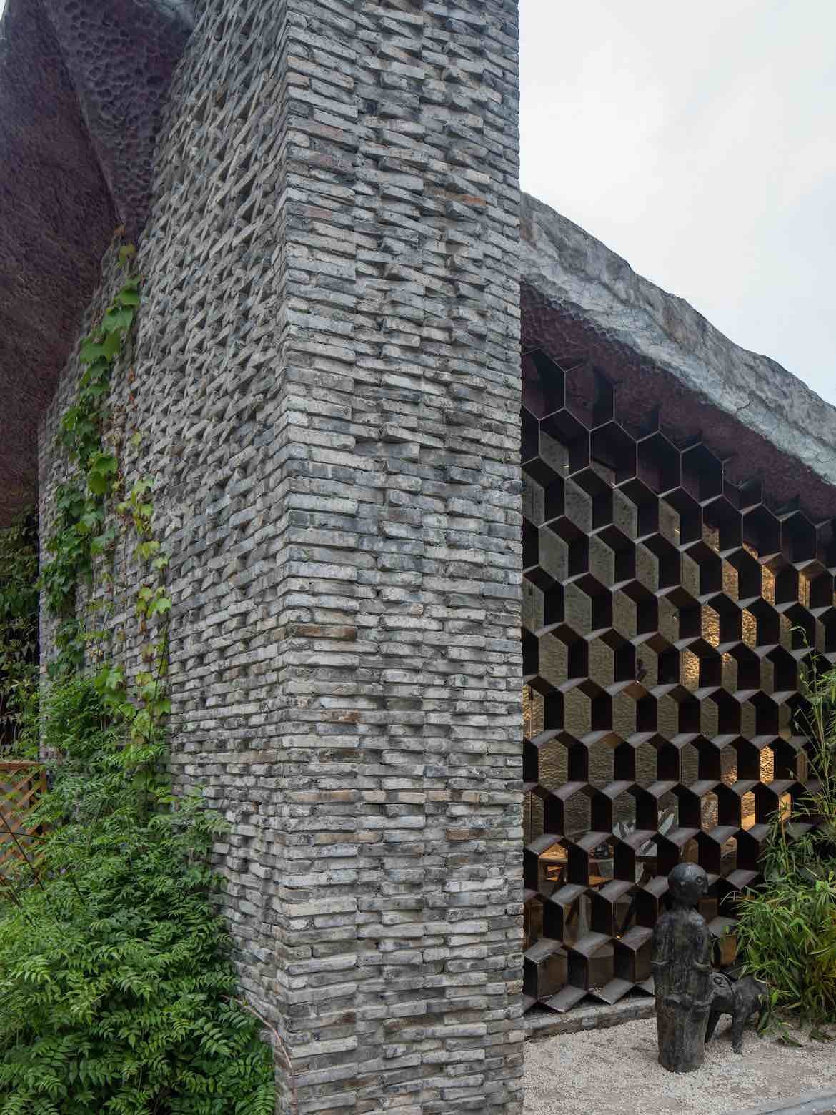 Exterior brickwork and honeycomb window pattern of Shangen Blossom Pavilion.