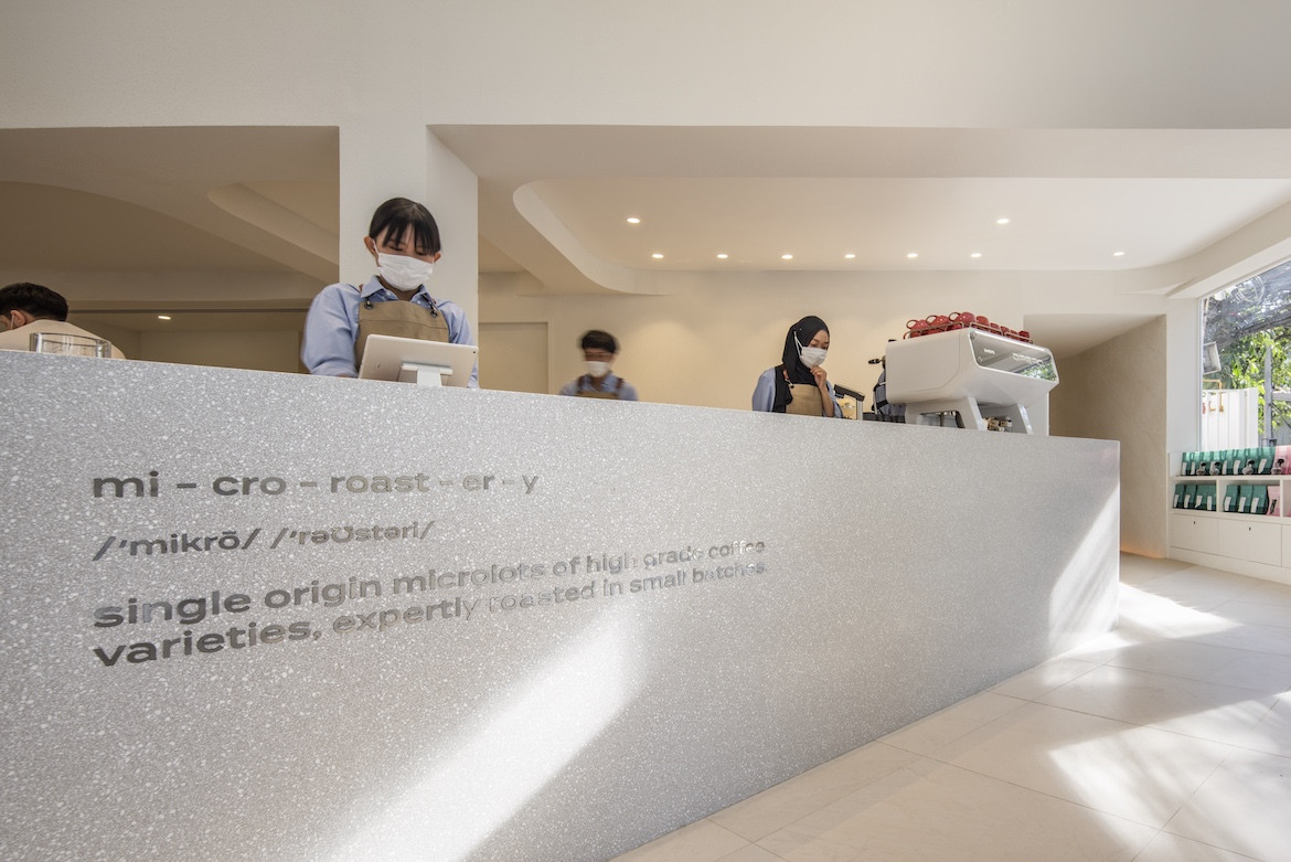 People serve behind the counter of Exterior of PAGA Microroastery