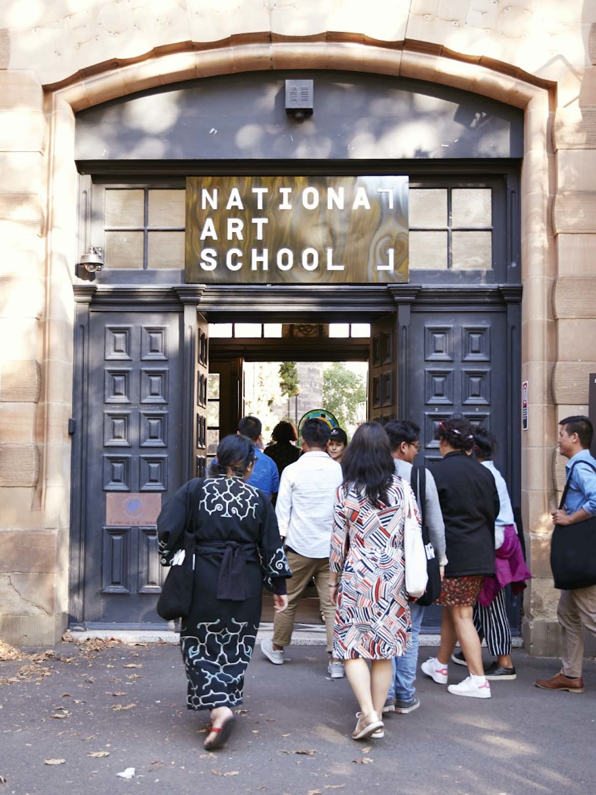 People walk into the National Art School during the Sydney Biennale 2021
