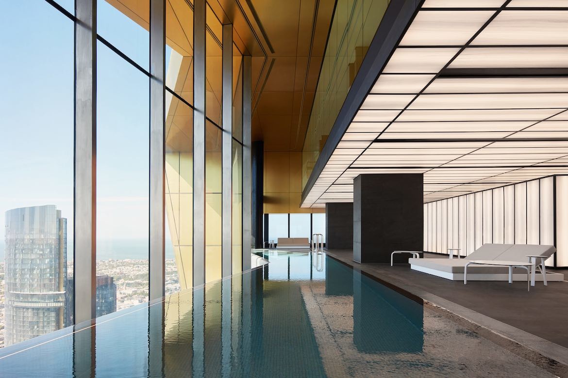 A view of the pool in 108 Australia building with windows overlooking the city, designed by Nonda Katsalidis and Fender Katsalidis.