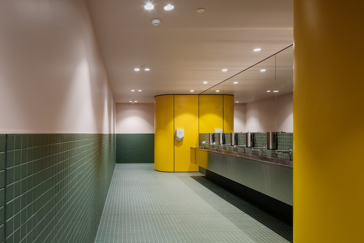 Science Gallery Melbourne yellow and green bathroom interior by Smart Design Studio.