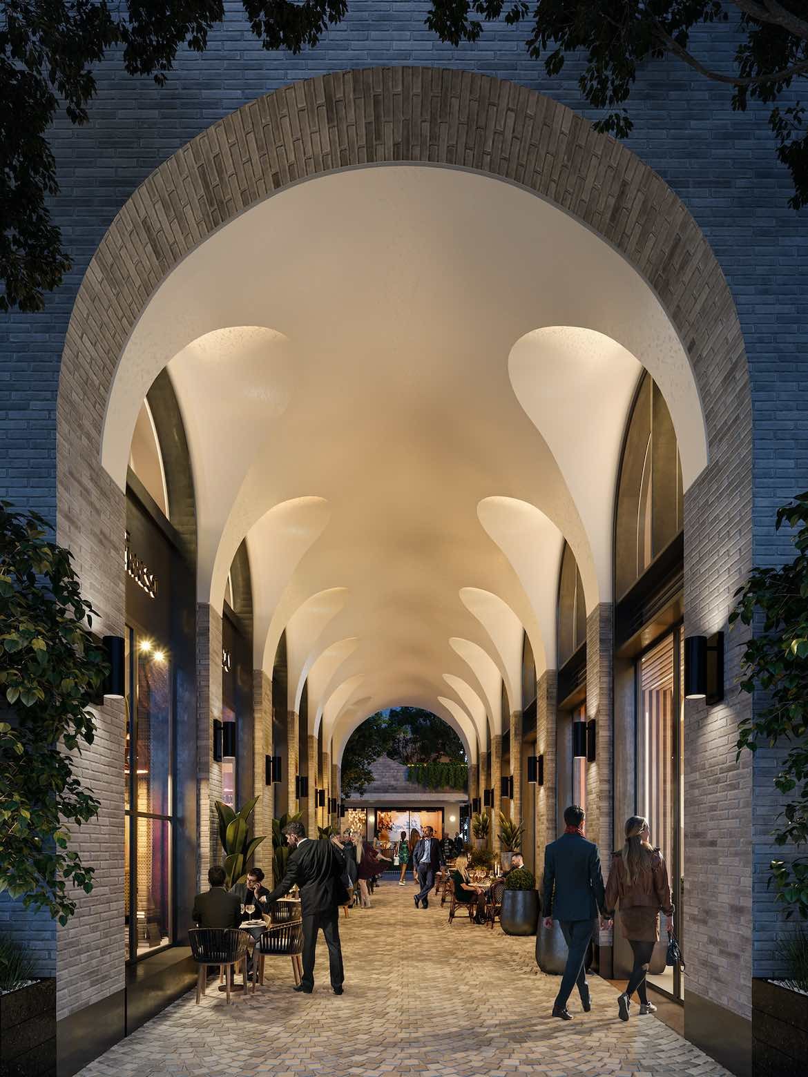 A render of a large arched walkway in the Surry Hills Village mixed-use development designed by SJB.